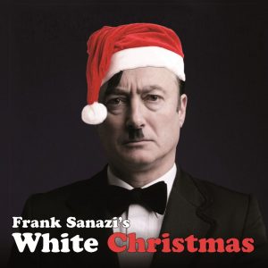 Frank Sanazi looking annoyed wearing a red and white christmas hat